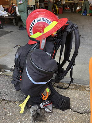wildland firefighters’ gear and helmet ready for deployment to a wildfire